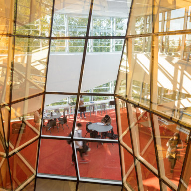 Wrapped around the oculus, the multi-storey “Vortex Lounge” draws students upward into a palpably collaborative environment from the moment they enter the building. Photo by Andrew Latreille.