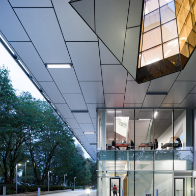 View looking west from under the building’s cantilever, showing student study areas and the oculus. Photo by Andrew Latreille.