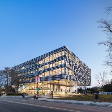 Responding to a severely constrained site and adjacent geothermal field, extensive program requirements, and the desire to maintain existing outdoor spaces and sight lines, a cantilevered solution was developed in concert with the project structural engineer that allows the mass of the building to hover over the College’s main entrance driveway. Photo by Andrew Latreille.