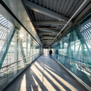 Interior view of the bridge. The bridge provides a vital pedestrian connection to the regions primary transit hub and between the north and south sides of the City of Pickering. Photo by Michael Muraz.